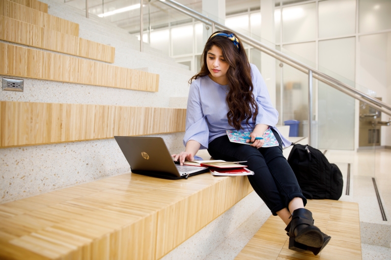 student types on computer