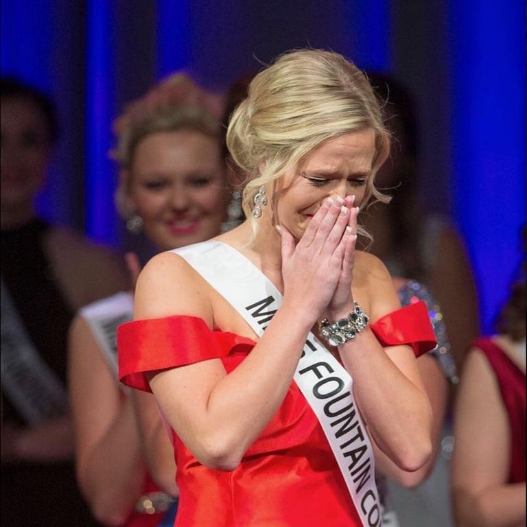 Audrey Campbell cries with joy on a pageant stage.
