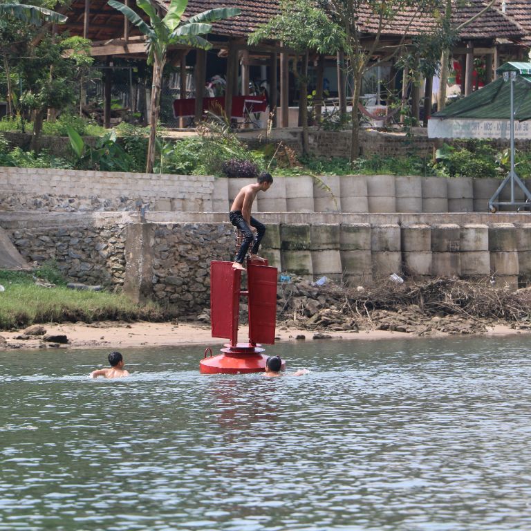 Children play in a river in Vietnam.