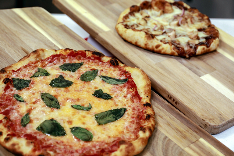 pizzas on wooden cutting boards