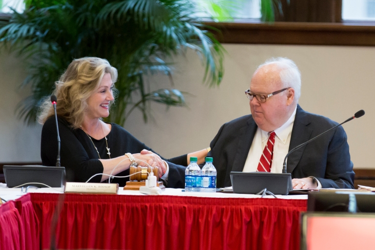MaryEllen Bishop sits with James Morris at a Board of Trustees meeting.