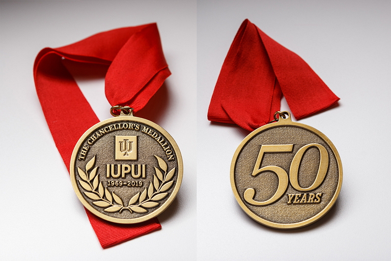 Front and back views of the 50th Anniversary Chancellor's Medallion