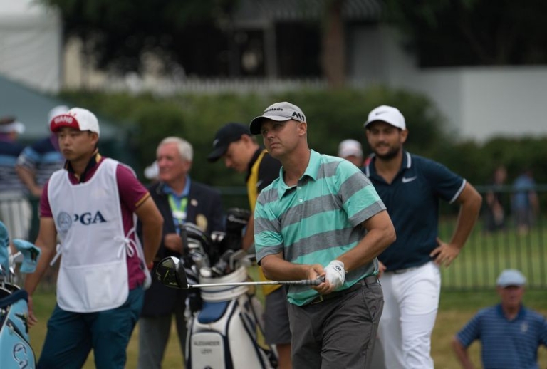 Jamie Broce watches a shot