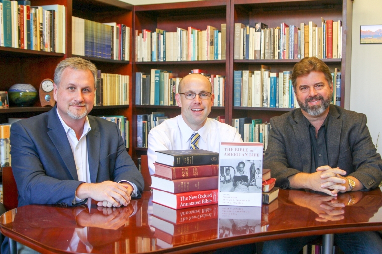 Philip Goff, Peter J. Thuesen and Arthur E. Farnsley II, sitting at a table with their book.