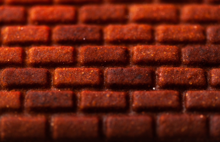 A close-up of brick details in gingerbread