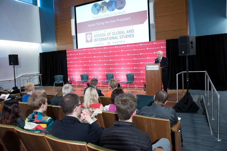 Richard Lugar, standing at a podium, addresses the audience