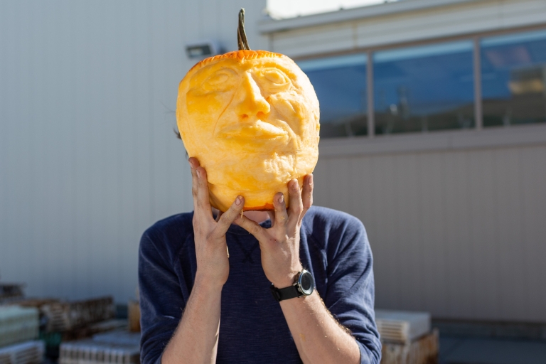 Zack Hurst shows off his carved pumpkin.
