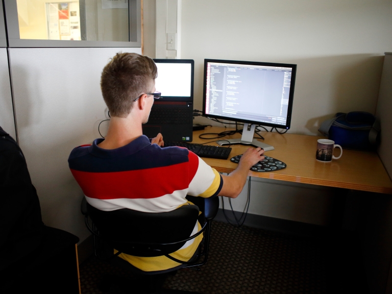 Avram working at his desk