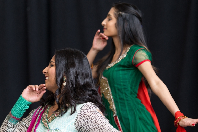 Two women perform at a prior International Festival