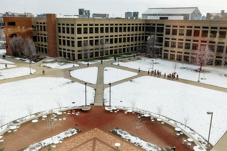 Snow covers the library courtyard.