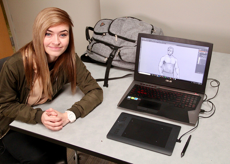 Jordan Nelsen sits with her computer.