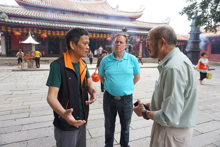 Dr. Zao C. Xu talks to a documentary subject.
