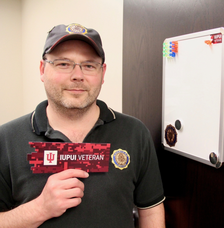 Cliff Morlan holds a veteran identifier bookmark.