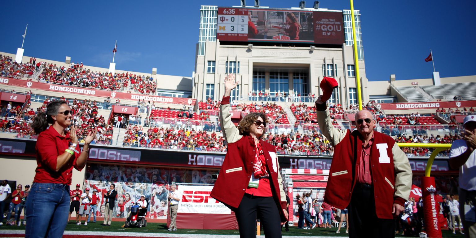 President McRobbie and Laurie McRobbie receive IU letter jackets.
