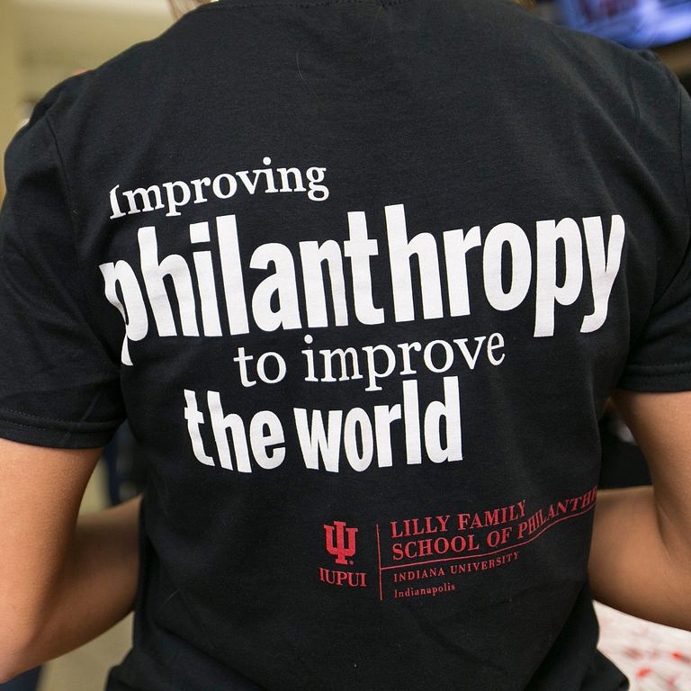 Back of T-shirt reads 'Improving philanthropy to improve the world.'