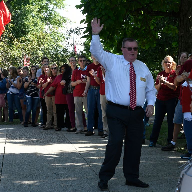 IU Southeast Chancellor Ray Wallace waves at incoming students