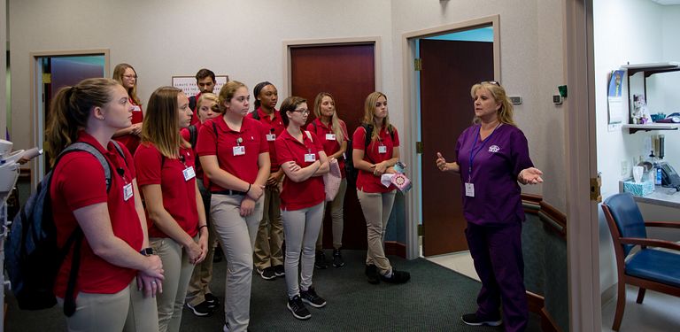 IU nursing students talk with a nurse in Paoli, Indiana