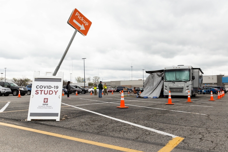 A sign reading "COVID-19 STUDY" is posted outside an IUPUI testing site in April 2020
