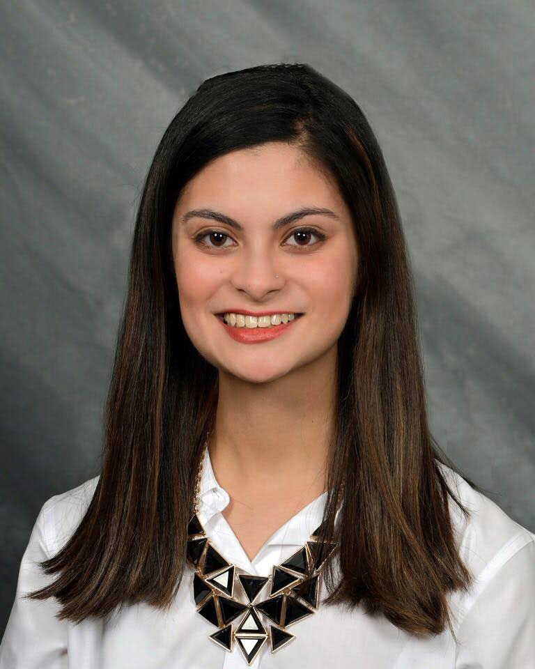 Headshot of Amna Sohail in front of a gray background.