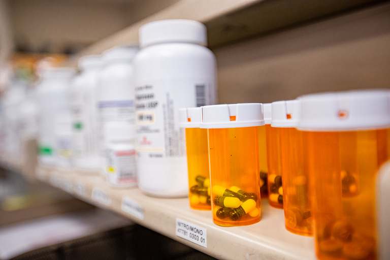 A row of bottled pills at the IU Health Center pharmacy.