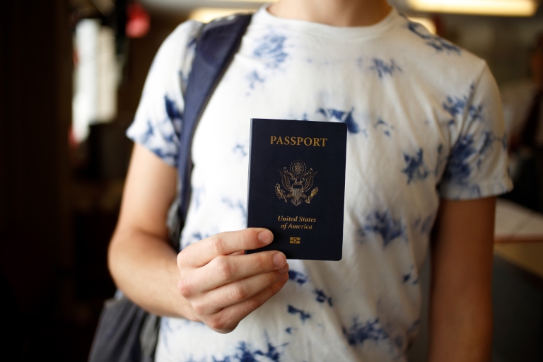 Student holding a passport
