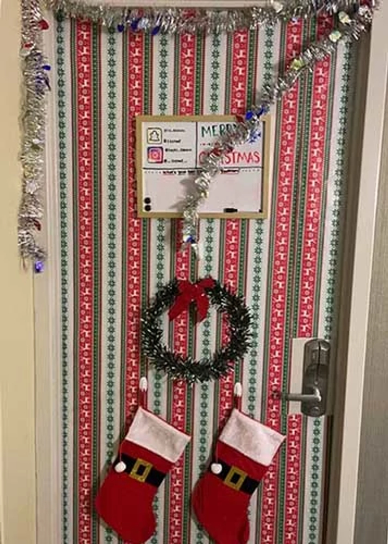 door with wreath and stockings