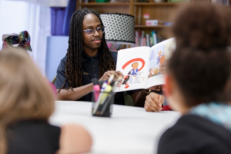 Tyler Kelley reads a book