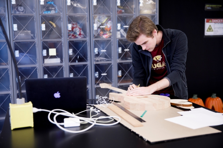 A student works in the fabrication lab