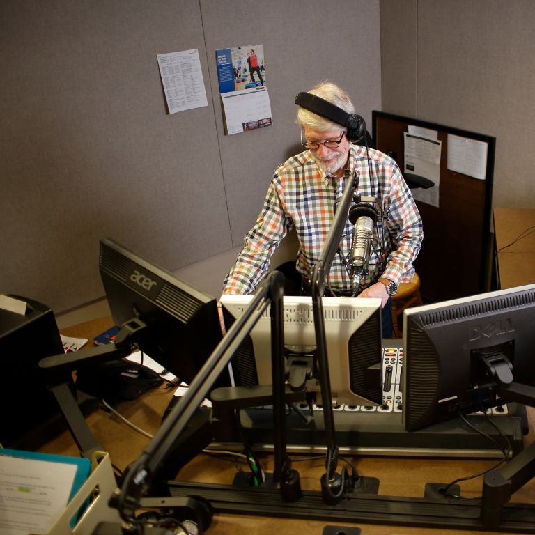 George Walker works on his computer at WFIU.