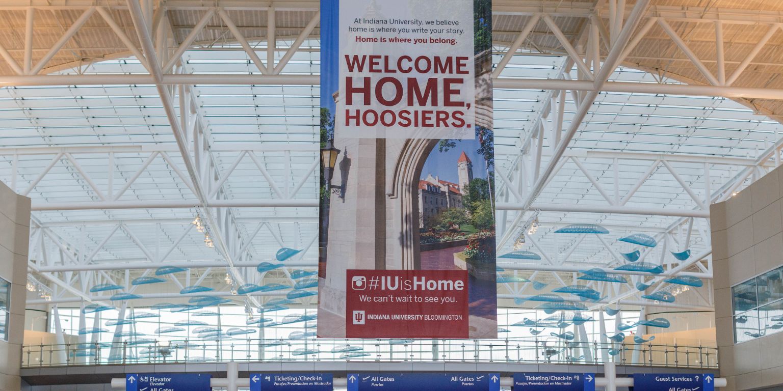 A 'Welcome home, Hoosiers' banner hanging in the airport