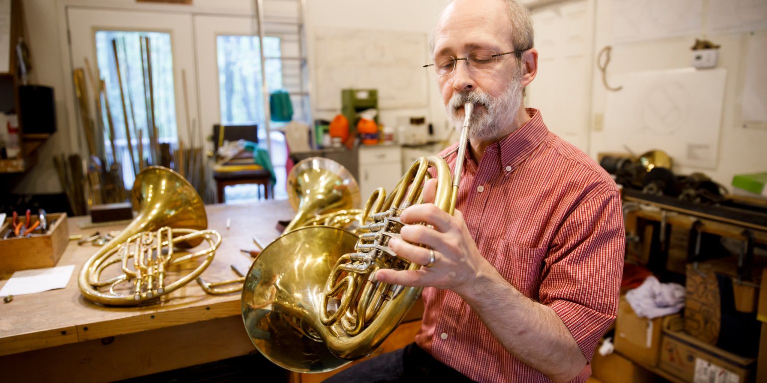 Rick Seraphinoff plays a French horn