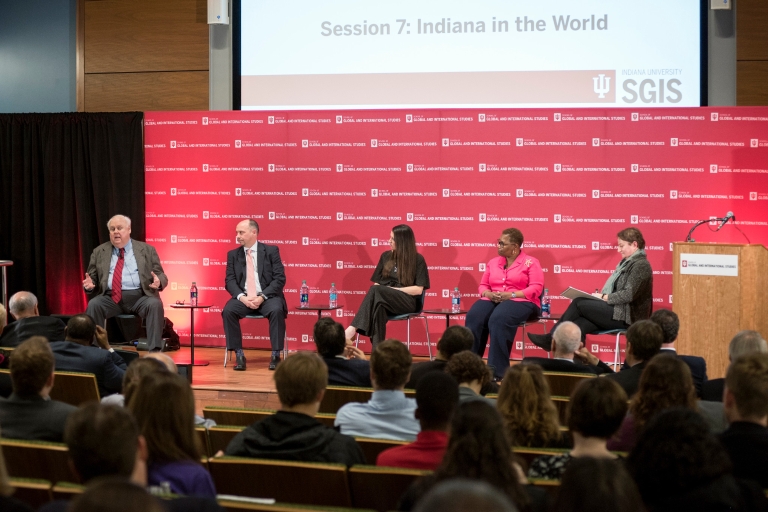 A panel of experts sits on stage during the America's Role in the World conference