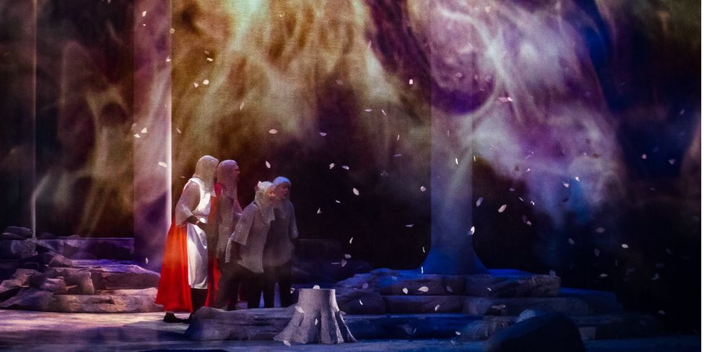 Knights and squires tumble through a windstorm in a dress rehearsal for Parsifal