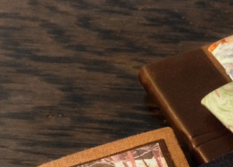 Handmade journals are pictured on a table 