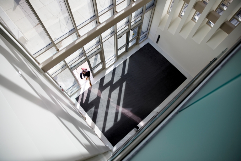 A student enters the O'Neill School of Public and Environmental Affairs in Bloomington