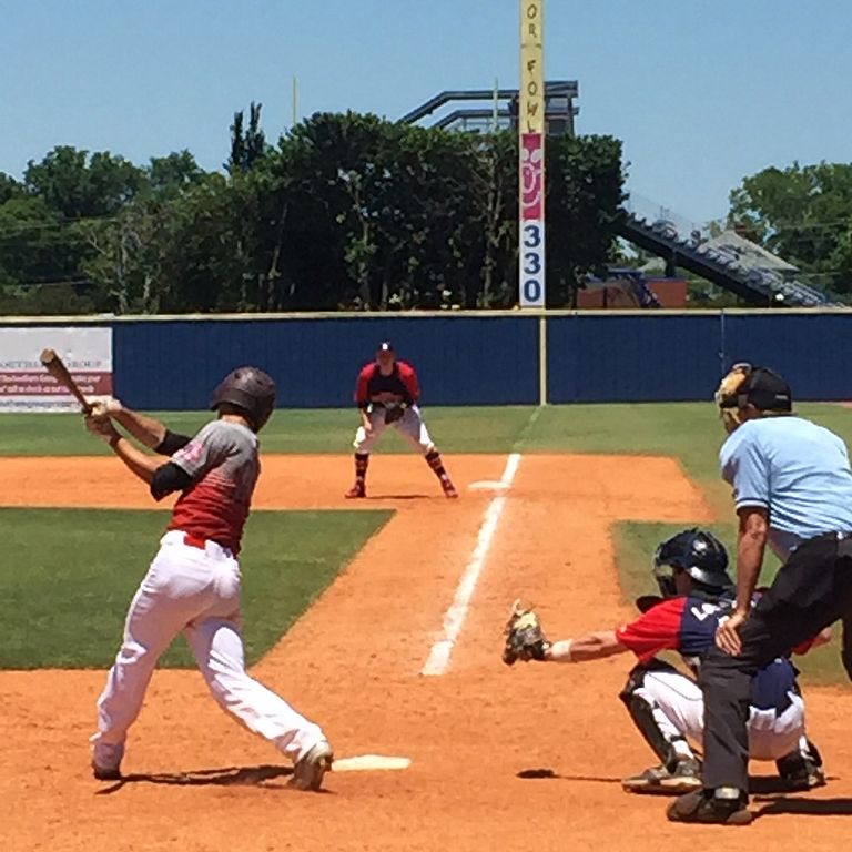 Batter swings at youth baseball tournament at Middle Tennessee State University.