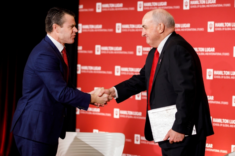 Todd Young shakes hands with Michael McRobbie.