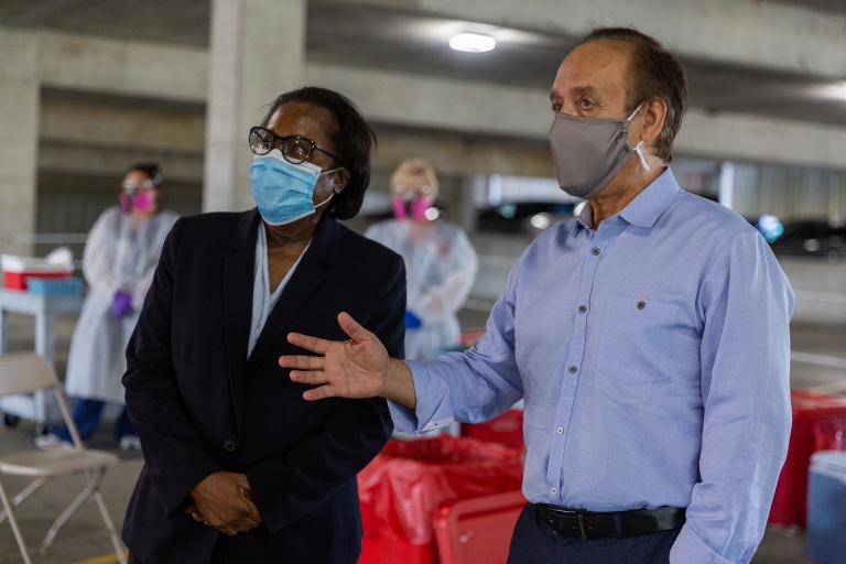 Chancellor Nasser H. Paydar and Dr. Virginia Caine observe IUPUI COVID-19 testing