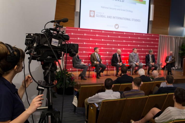 Camera person covering America's Role in the World conference