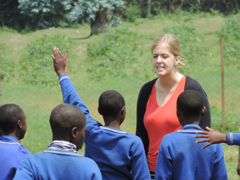 IU student Martha Midkiff speaks to students at the Kabwende Primary School in Rwanda. 