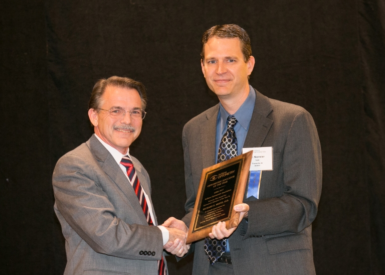 Richard Meetz receives the Indiana Optometric Association Educator of the Year Award.