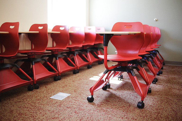 Red chairs in a classroom