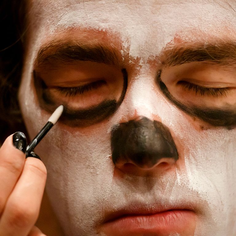 A student has his face painted