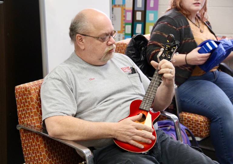Chuck Sturgeon plays his ukulele.
