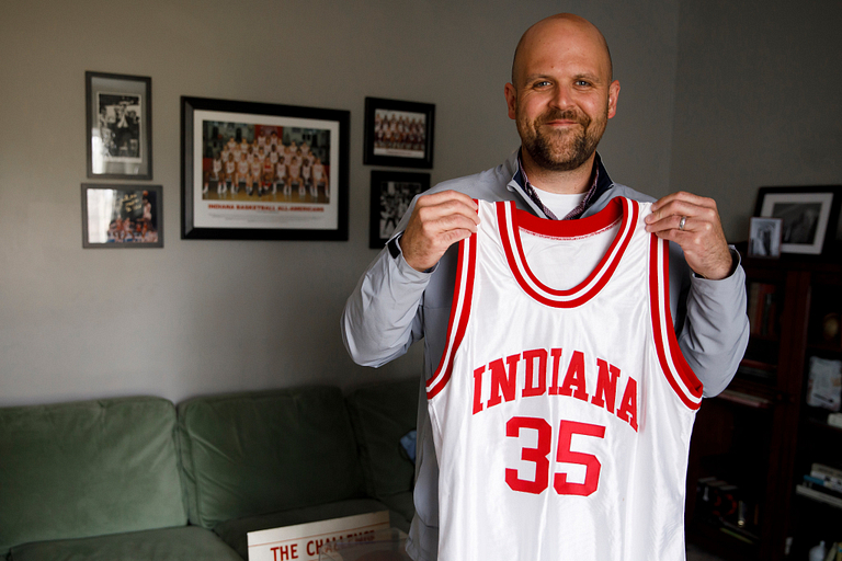 Collecting college basketball jerseys is more than a hobby for man