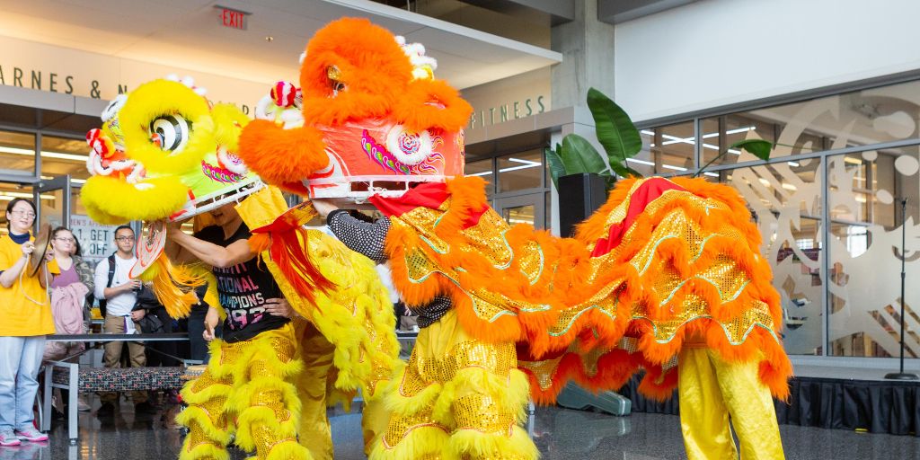 Members of the Indianapolis Chinese Community Center perform with dragon puppets