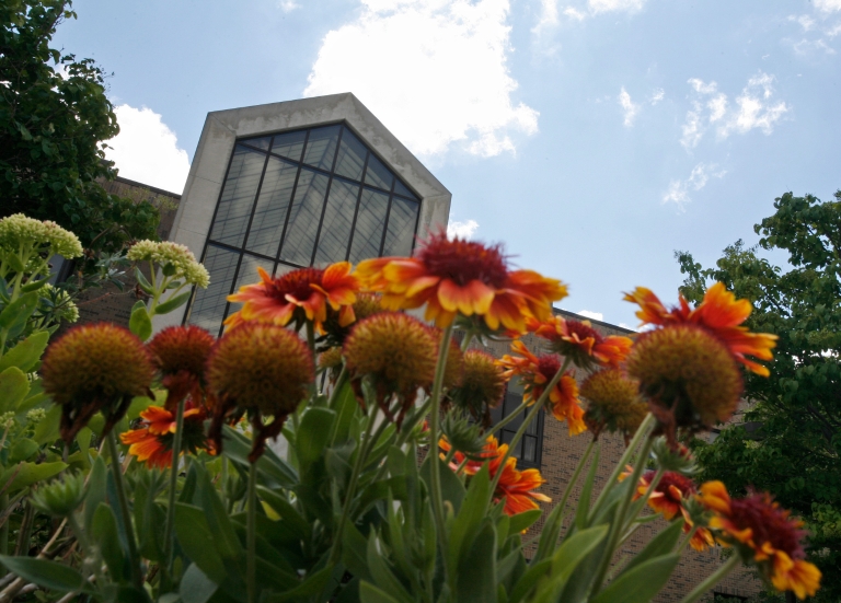 Flowers frame Hayes Hall on the IU East campus.