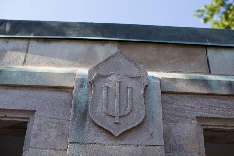 A limestone trident on an IU building