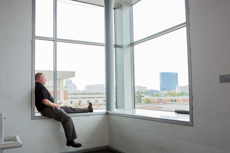 Campus Center Director Joe Hayes relaxes in the stairwell window area