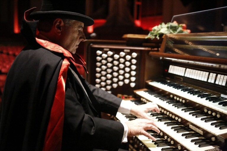 Dennis James wears a costume while playing the pipe organ